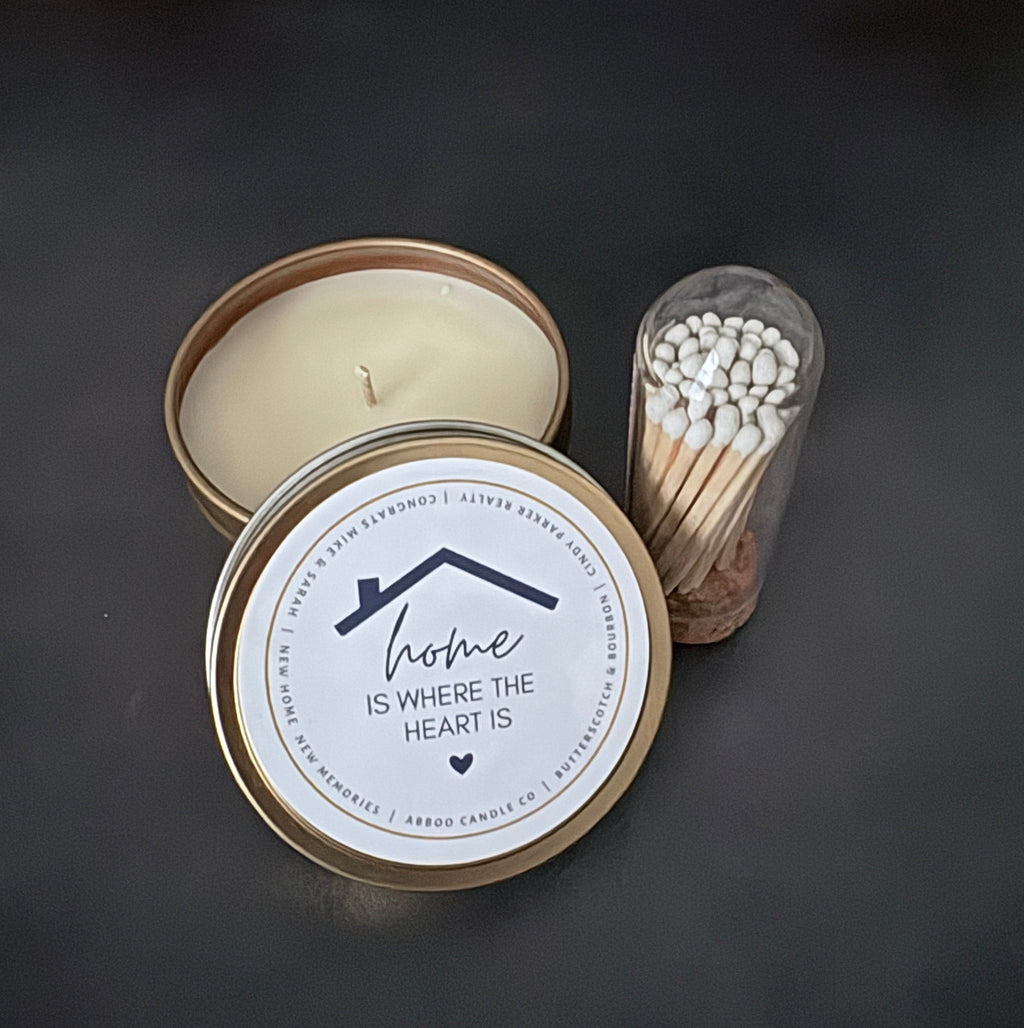 Hand poured candle in a gold tin with a custom "Home" label made for SD Gift Co in Fortville, IN