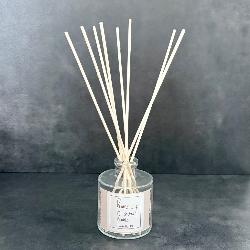 Local reed diffuser with custom label used in SD Gift Co gift baskets for realtors in Indiana.