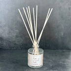 Local reed diffuser with custom label used in SD Gift Co gift baskets for realtors in Indiana.