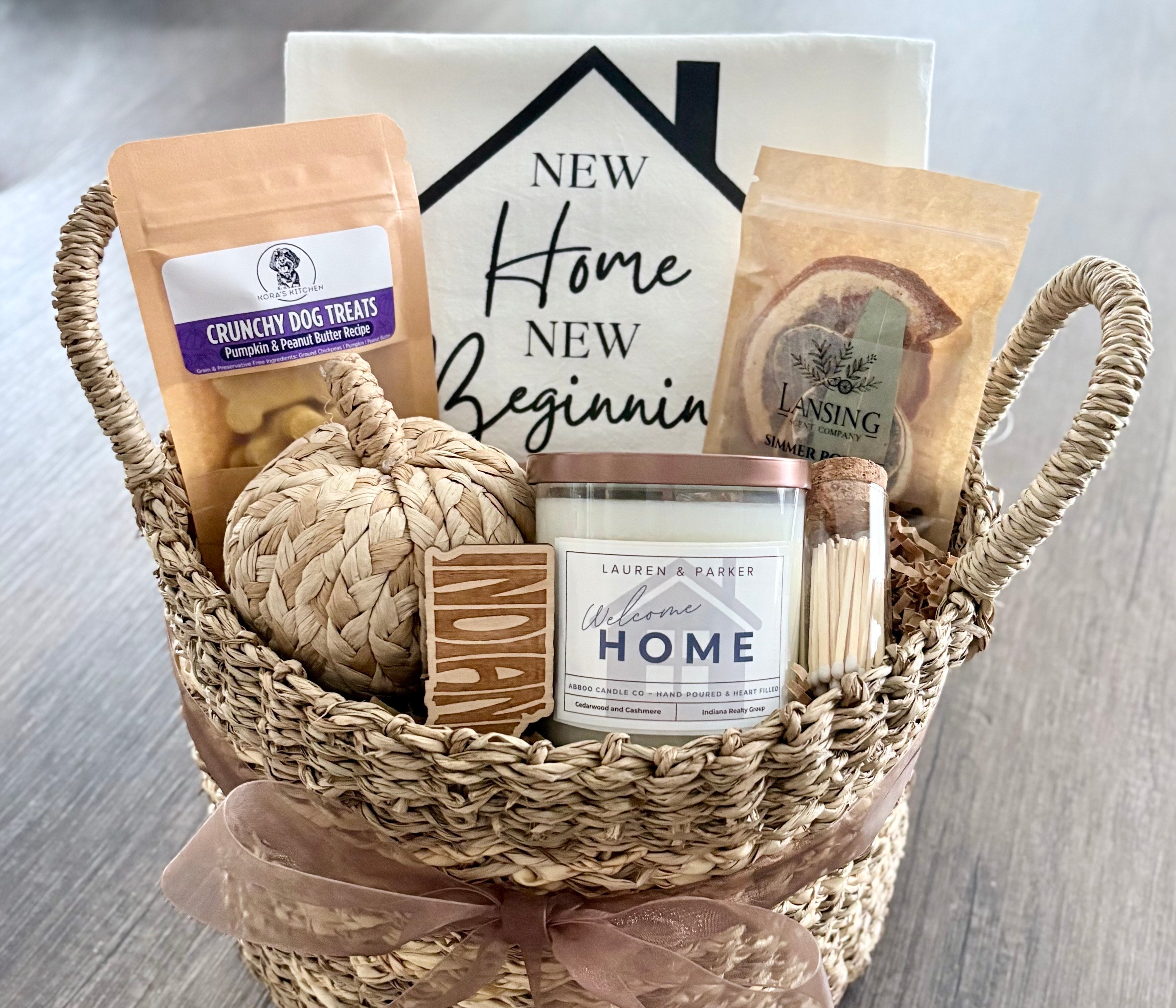 Closing gift basket for realtors in Indiana with local candle, dog treats, and New Home tea towel.