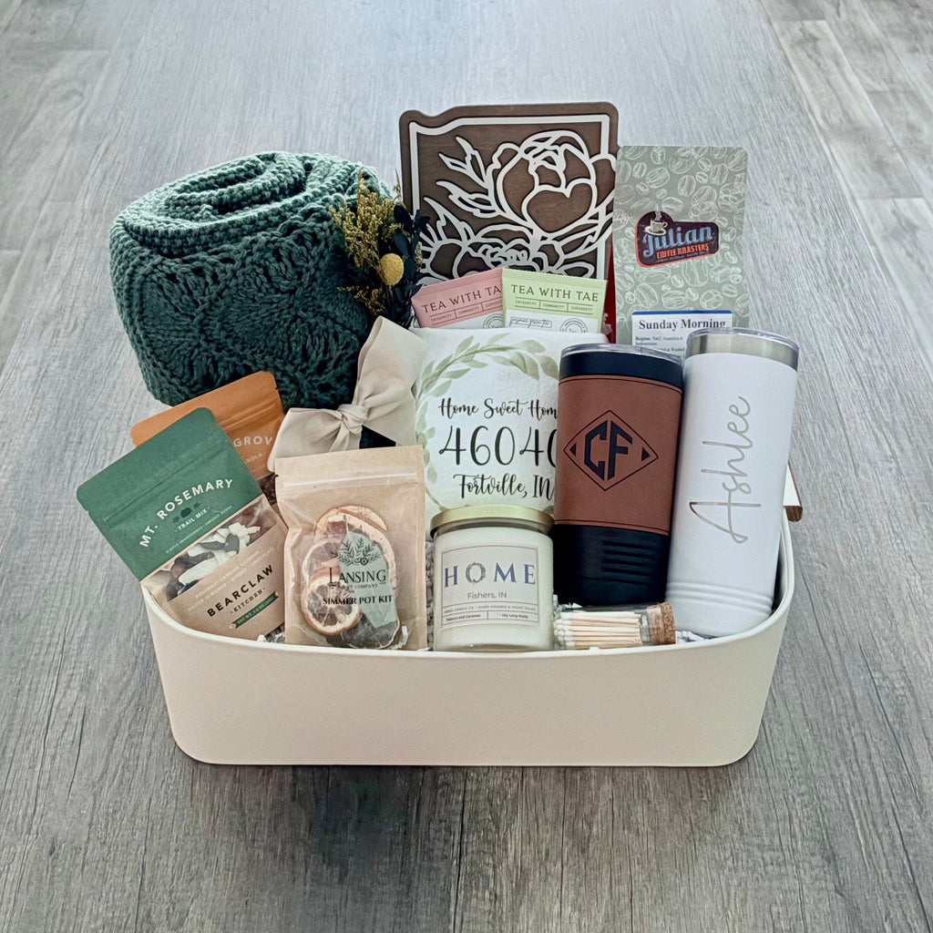 The Signature closing gifts basket by SD Gift Co including local candle, IN state sign, and engraved tumblers.