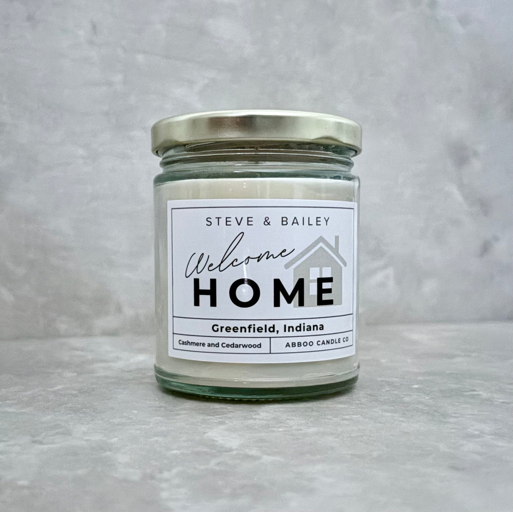 Hand poured candle with custom welcome home label made for SD Gift Co in Fortville, IN