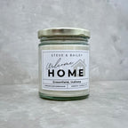 Hand poured candle with custom welcome home label made for SD Gift Co in Fortville, IN