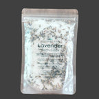 Lavender bath soak package on a wooden surface